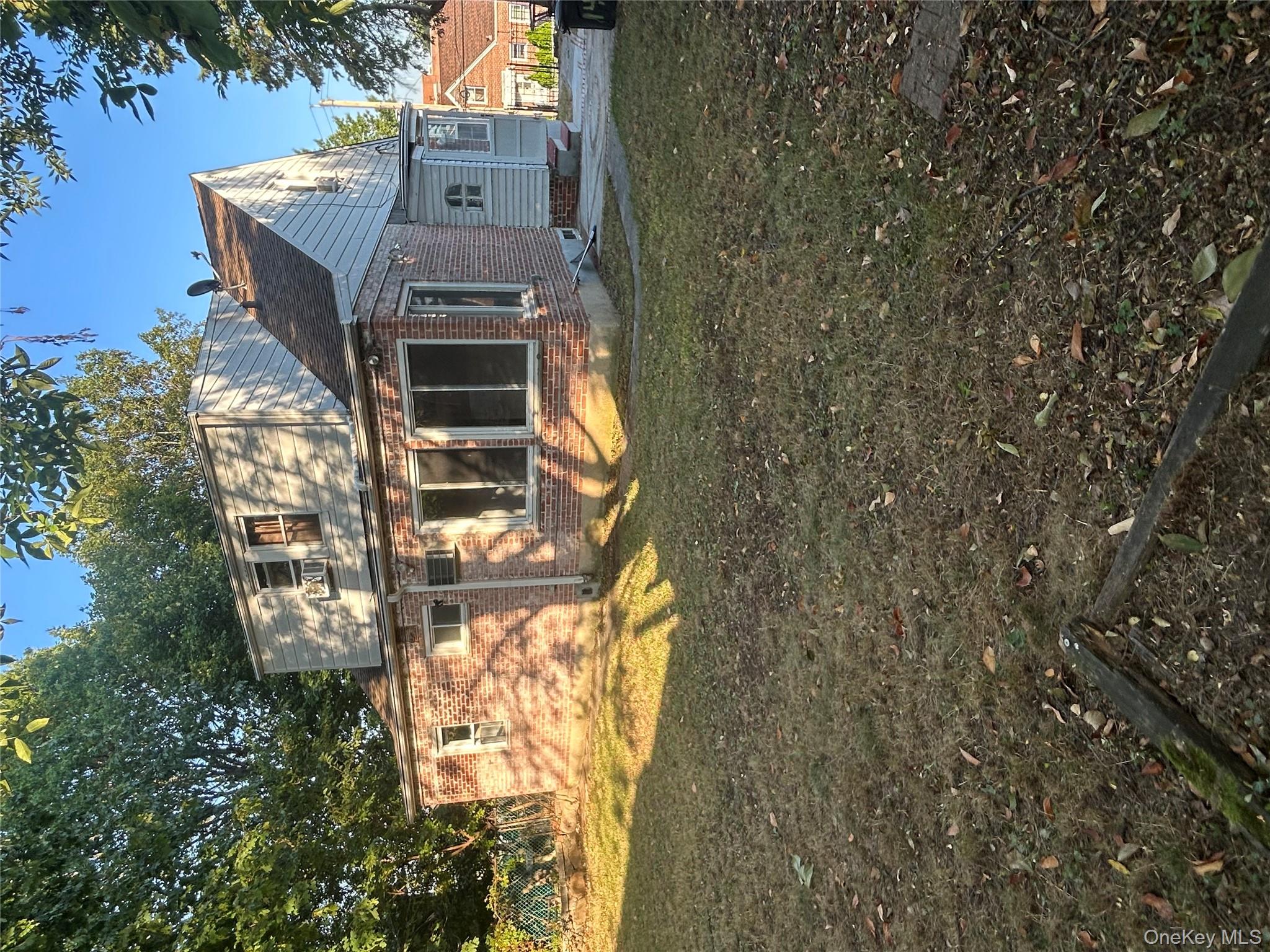 141 Sterling Avenue Yonkers, NY 10704 - Photo 3 of 23 a view of a house with backyard