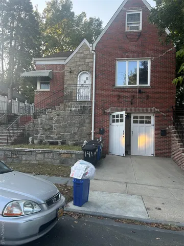 a view of a house with back yard and a fire pit