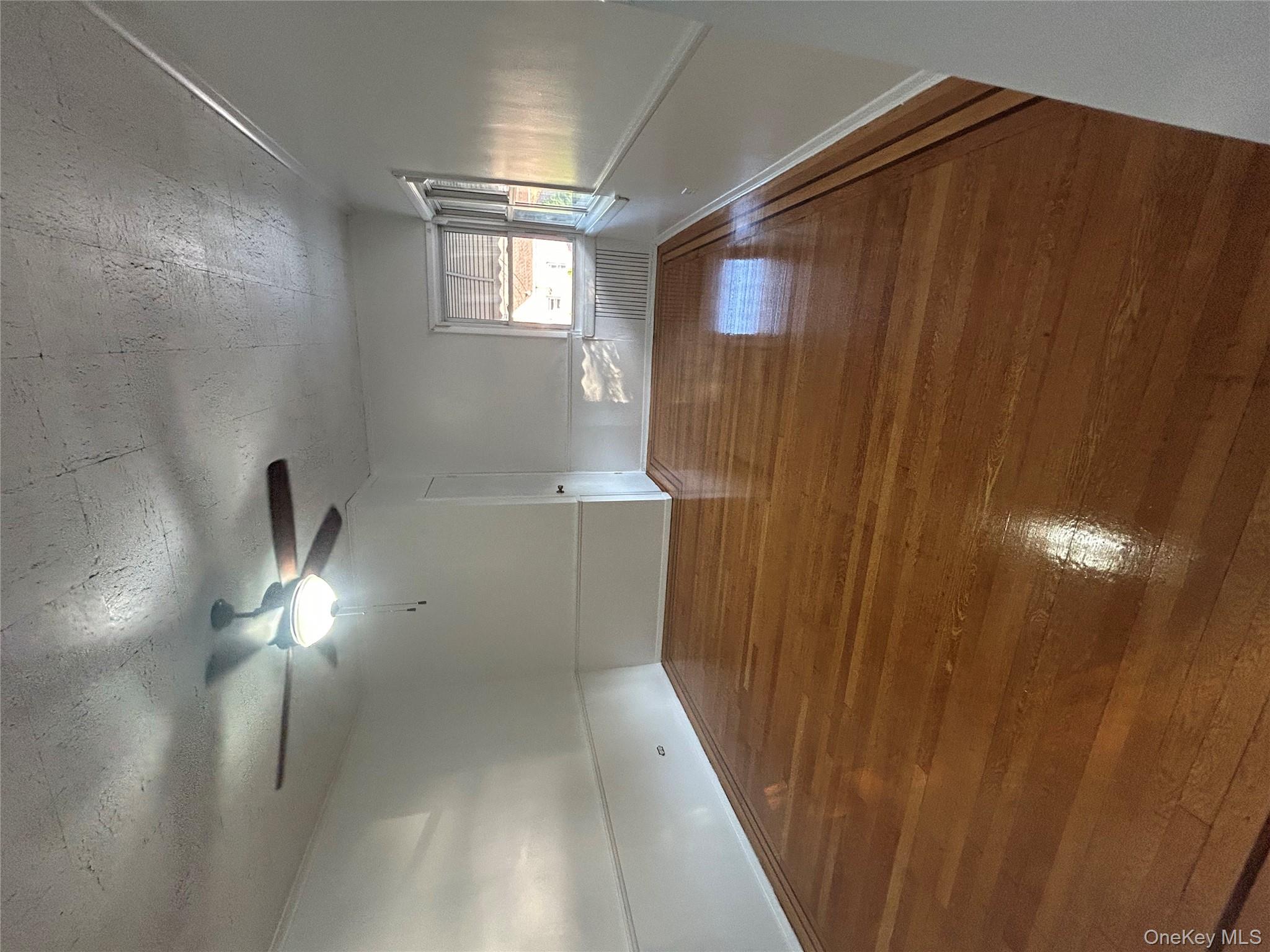 141 Sterling Avenue Yonkers, NY 10704 - Photo 7 of 23 a view of an empty room with a window