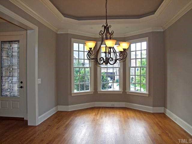 4188 English Garden Way Raleigh, NC 27612 - Photo 3 of 25 Bay window adds to the charm of the formal dining room. Great wall for placing furniture.