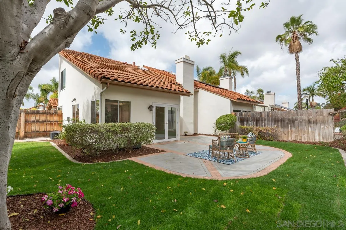 12515 Spindletop Road San Diego, CA 92129 - Photo 15 of 32 a view of a house with a backyard and a garden