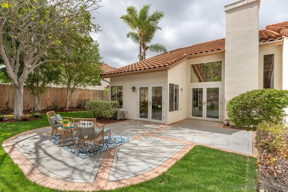 12515 Spindletop Road San Diego, CA 92129 - Photo 16 of 32 a view of a house with backyard and sitting area