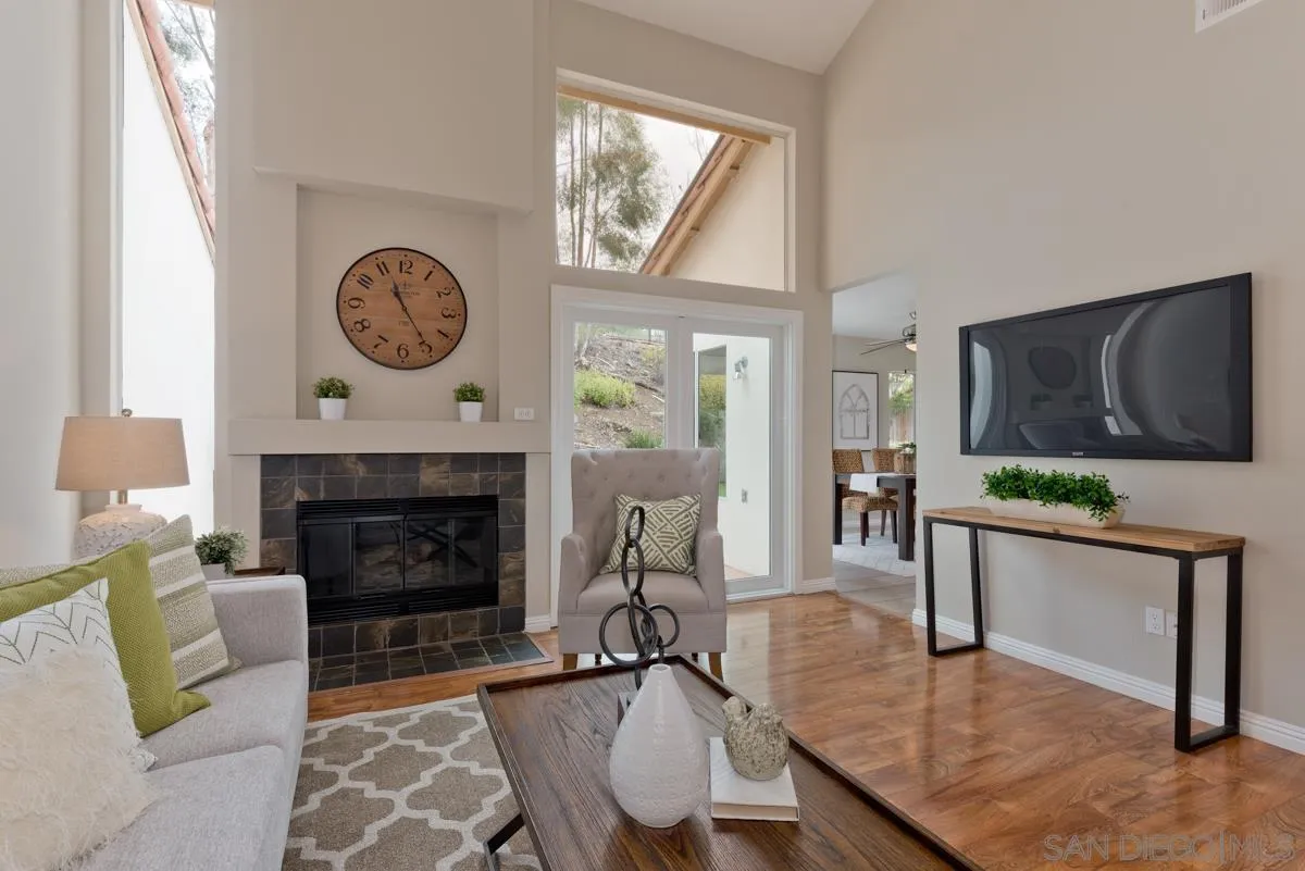 12515 Spindletop Road San Diego, CA 92129 - Photo 20 of 32 a living room with furniture and a fireplace