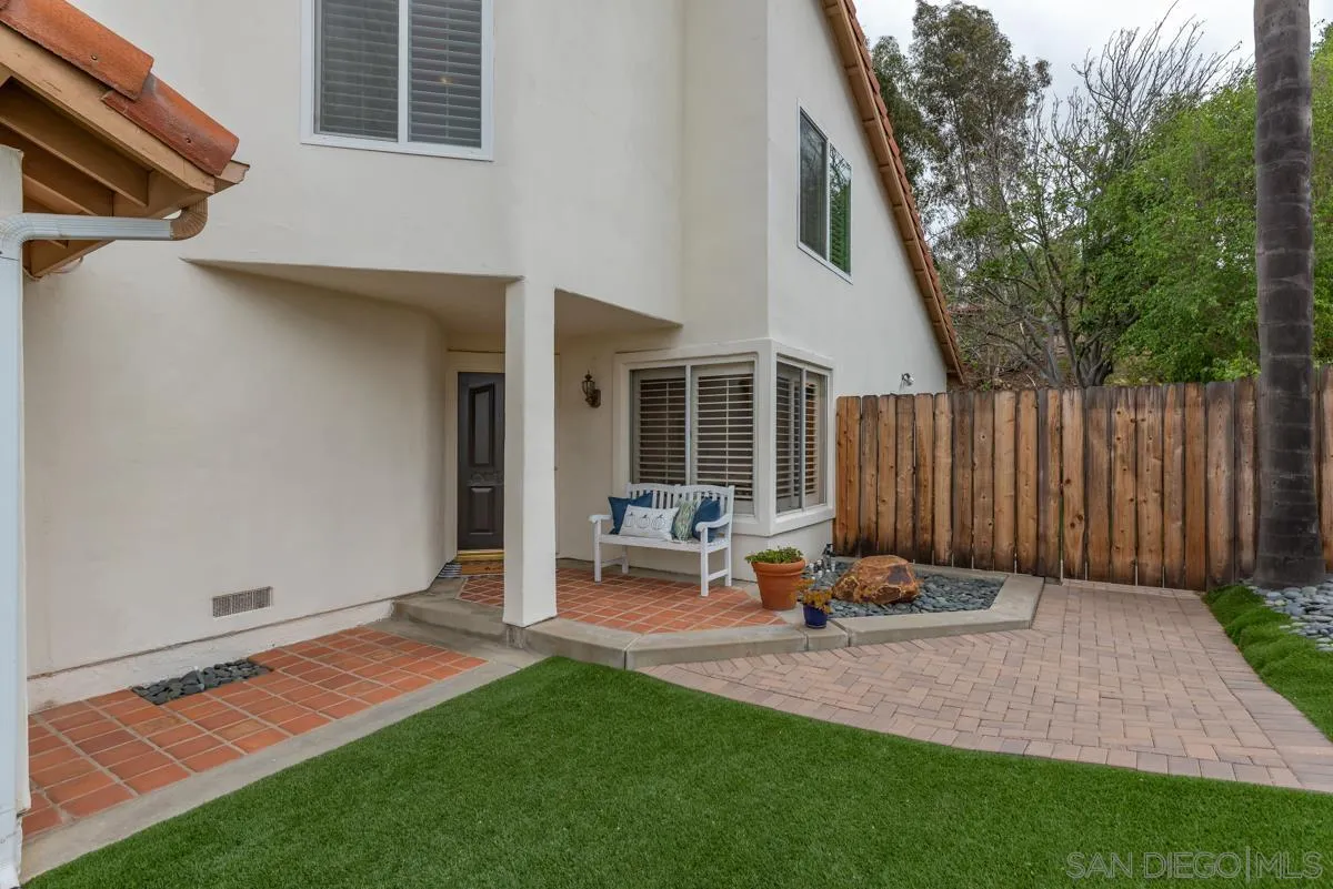 12515 Spindletop Road San Diego, CA 92129 - Photo 2 of 32 a backyard of a house with table and chairs