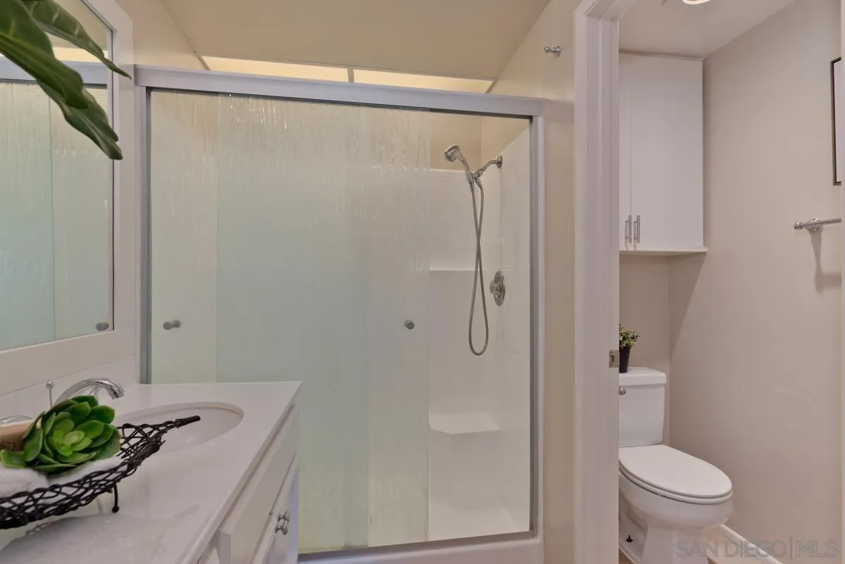 12515 Spindletop Road San Diego, CA 92129 - Photo 28 of 32 a bathroom with a shower and a toilet