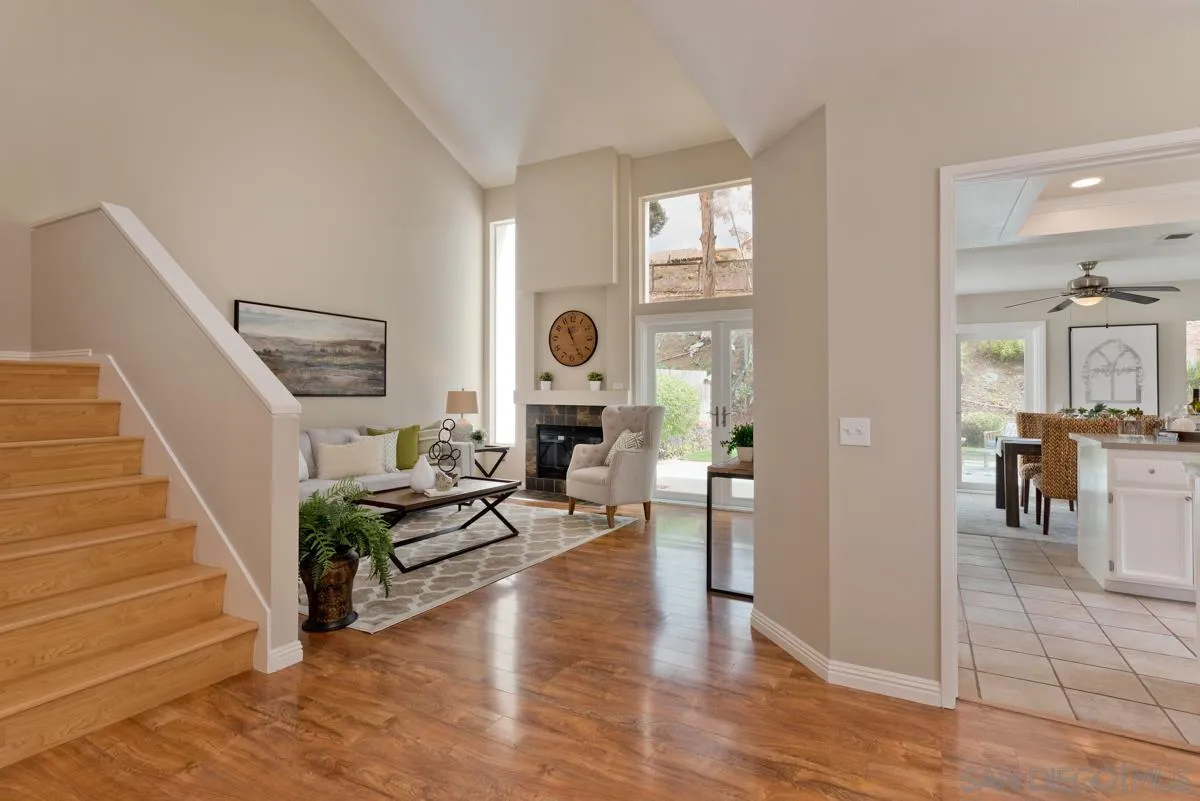 12515 Spindletop Road San Diego, CA 92129 - Photo 3 of 32 a living room with furniture and wooden floor