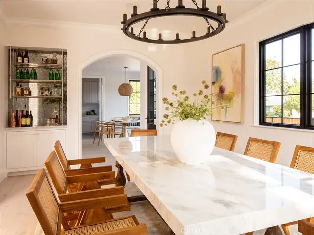 a view of a dining room with furniture and a large window