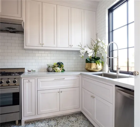 a kitchen with a stove and cabinets