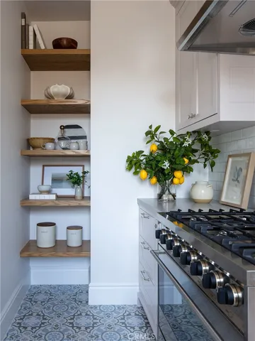 a living room with furniture a window and chairs