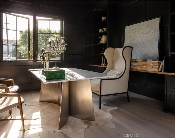 a view of a livingroom with a fireplace and window