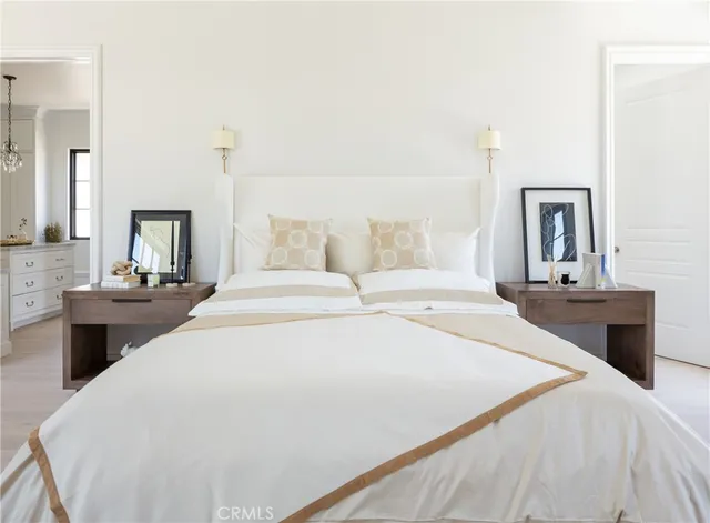 a spacious bathroom with a double vanity sink a large mirror and shower