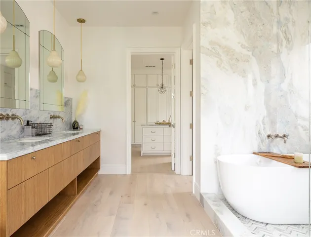 a kitchen with a sink a stove and cabinets