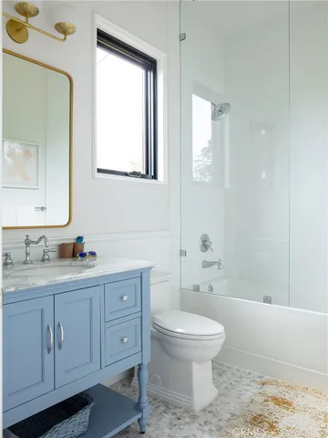 a backyard of a house with outdoor seating