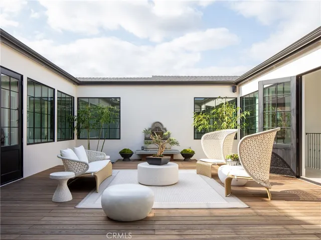a view of a living room and floor to ceiling window or couch