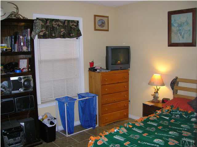 4250 Stephens Road Pace, FL 32571 - Photo 4 of 7 Additional Bedroom with tile floors