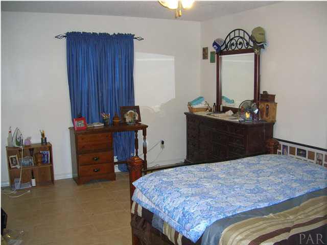 4250 Stephens Road Pace, FL 32571 - Photo 5 of 7 Master Bedroom with tile floors