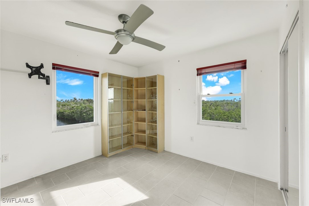 8151 Moyer Lane Bokeelia, FL 33922 - Photo 15 of 49 a view of an empty room with a window