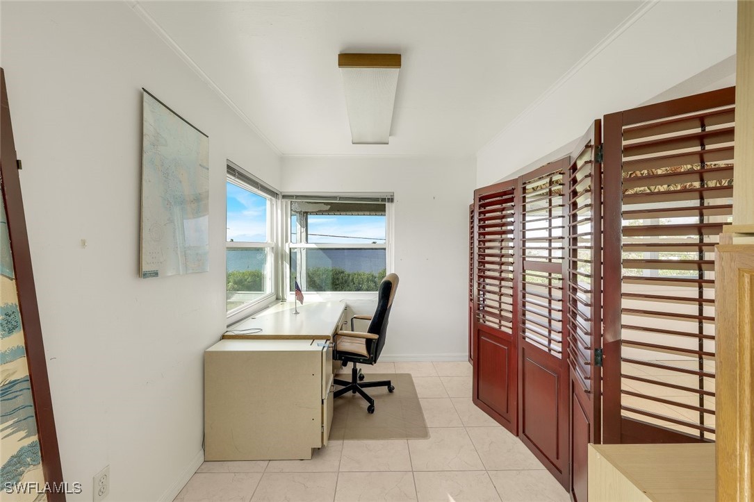 8151 Moyer Lane Bokeelia, FL 33922 - Photo 20 of 49 a room with a table and chairs