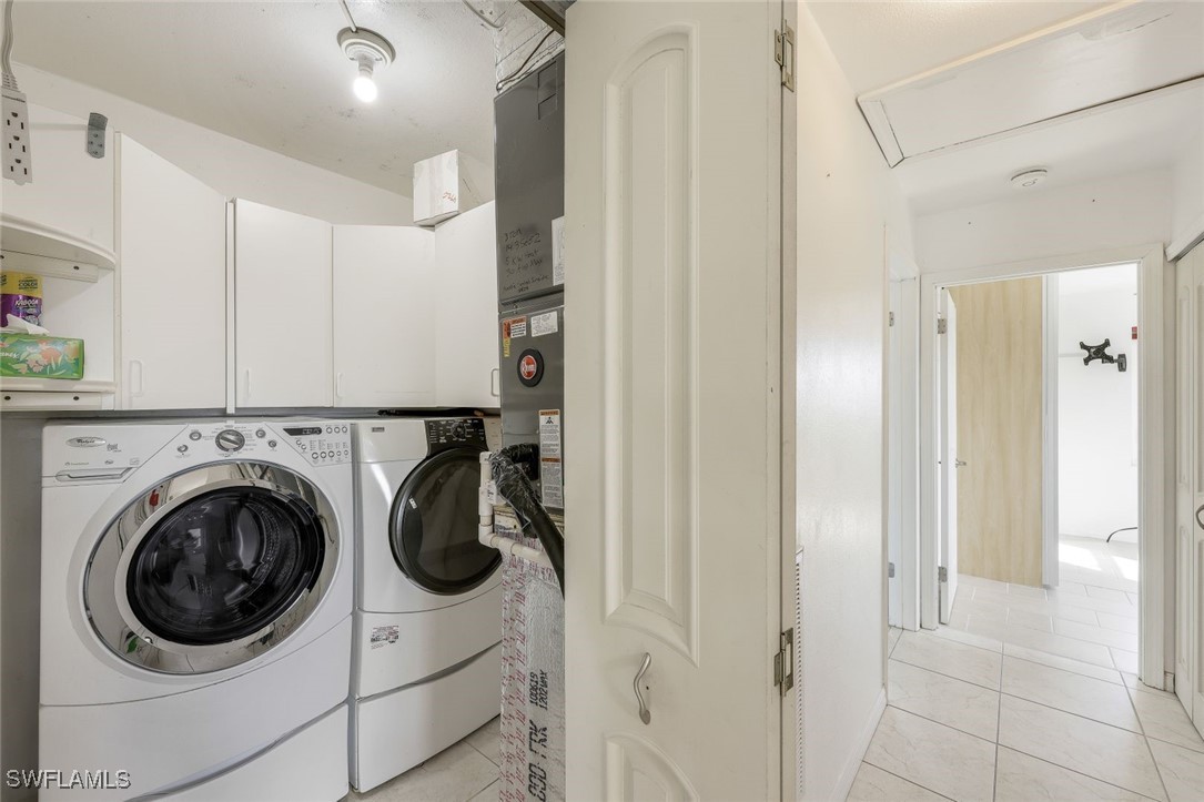 8151 Moyer Lane Bokeelia, FL 33922 - Photo 21 of 49 a utility room with sink dryer and washer