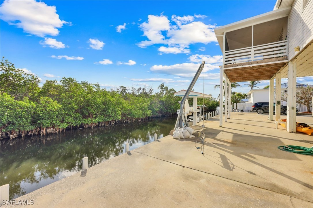 8151 Moyer Lane Bokeelia, FL 33922 - Photo 23 of 49 a view of a lake with a patio