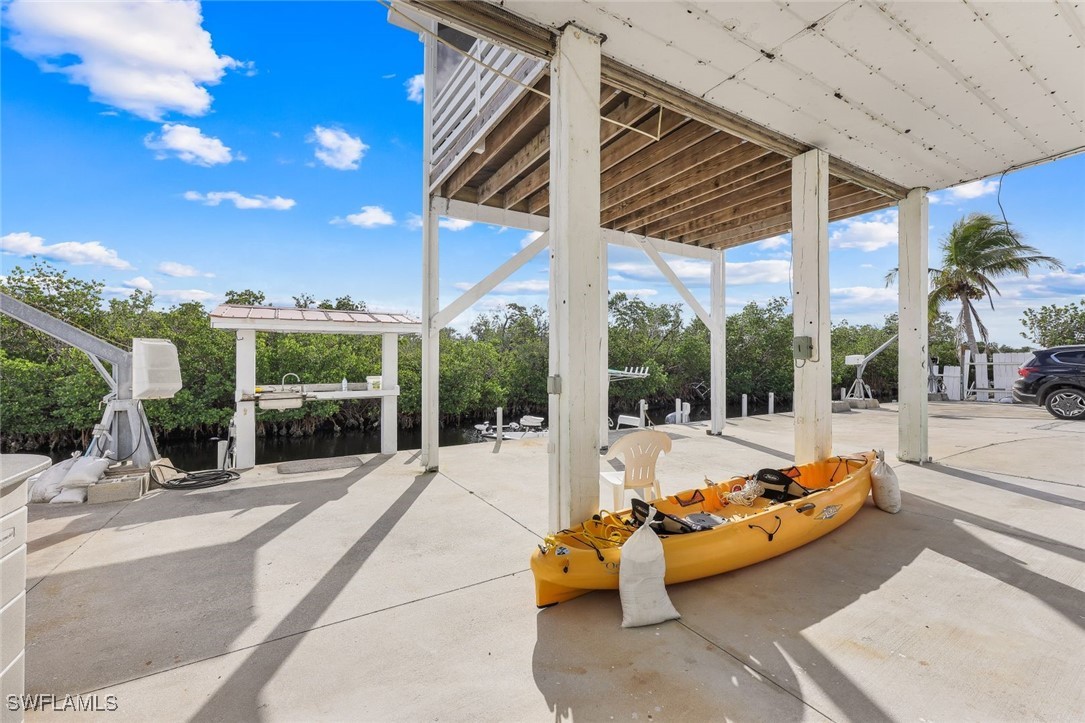 8151 Moyer Lane Bokeelia, FL 33922 - Photo 24 of 49 a outdoor space with patio the couch and chairs