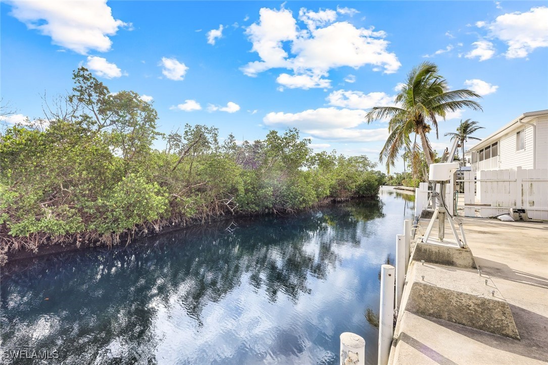 8151 Moyer Lane Bokeelia, FL 33922 - Photo 28 of 49 a view of a lake with outside seating space