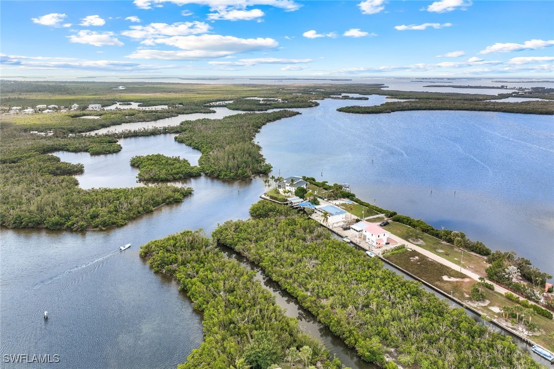 8151 Moyer Lane Bokeelia, FL 33922 - Photo 29 of 49 a view of an ocean and beach
