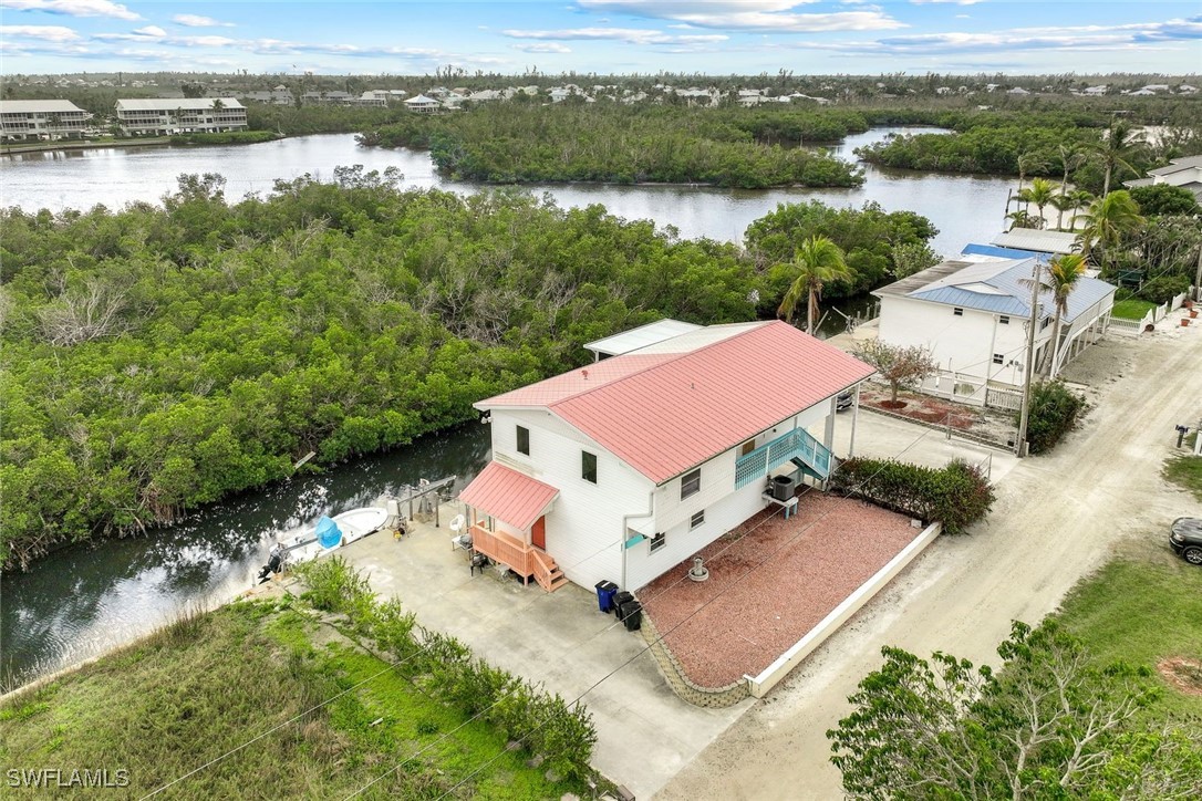 8151 Moyer Lane Bokeelia, FL 33922 - Photo 34 of 49 an aerial view of houses with yard
