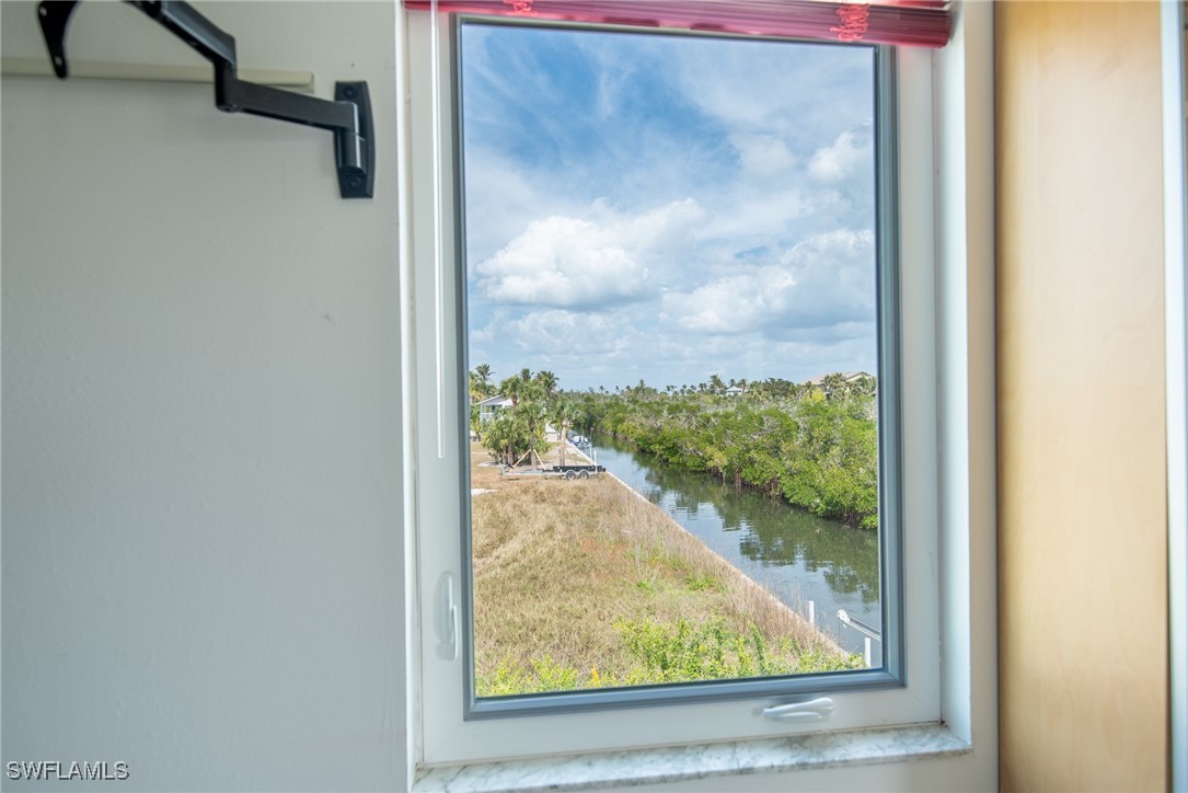 8151 Moyer Lane Bokeelia, FL 33922 - Photo 41 of 49 a view of a glass door with a view of the house