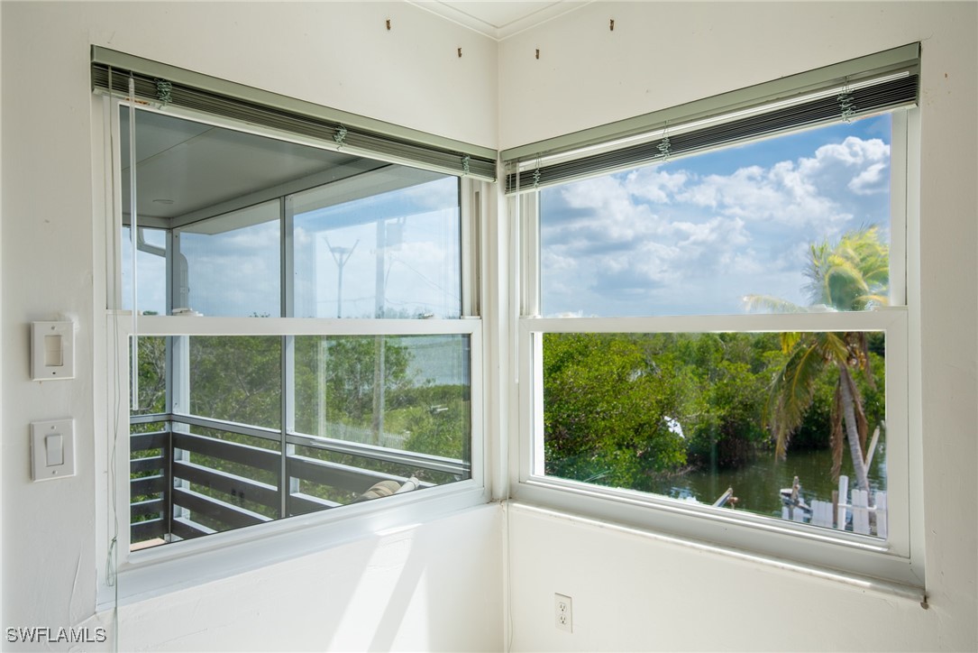 8151 Moyer Lane Bokeelia, FL 33922 - Photo 43 of 49 a view of a glass door with a door and a window