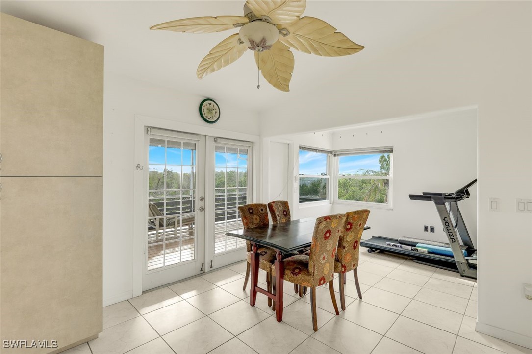 8151 Moyer Lane Bokeelia, FL 33922 - Photo 6 of 49 a dining room with furniture and a window