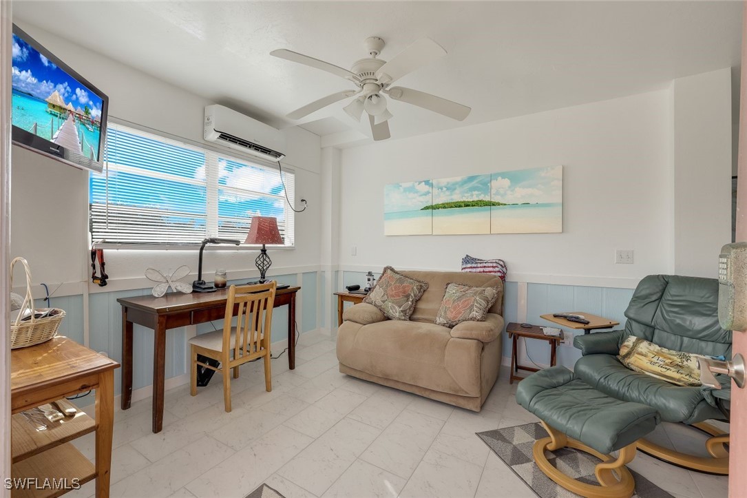 8151 Moyer Lane Bokeelia, FL 33922 - Photo 9 of 49 a living room with furniture and a large window