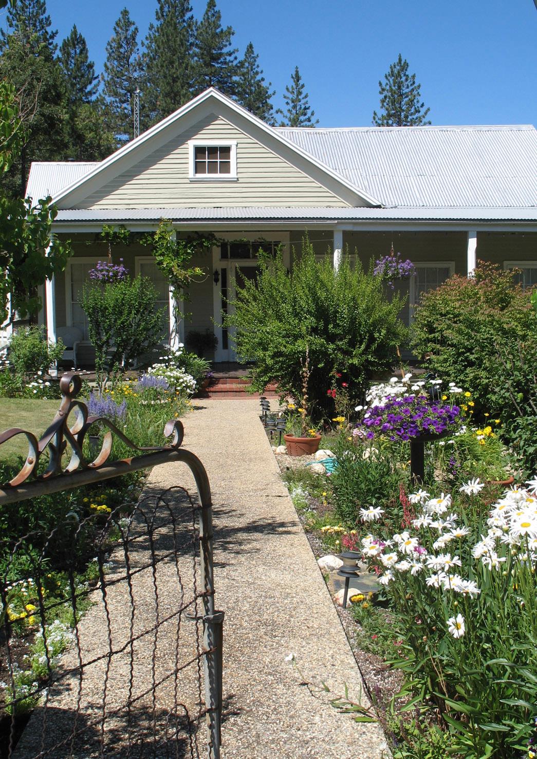 a front view of a house with garden