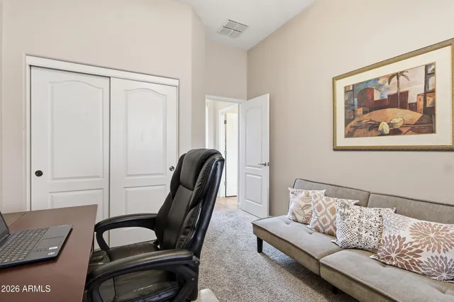 a view of a livingroom with furniture and lounge chair