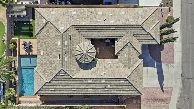 a view of a patio with table and chairs with wooden floor and plants