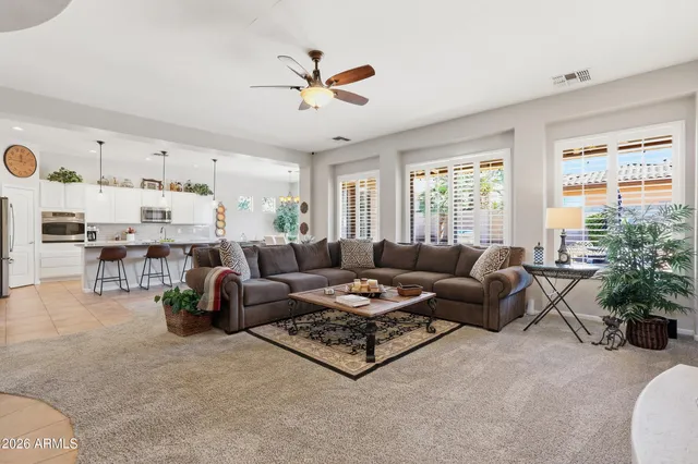 a living room with furniture and a large window
