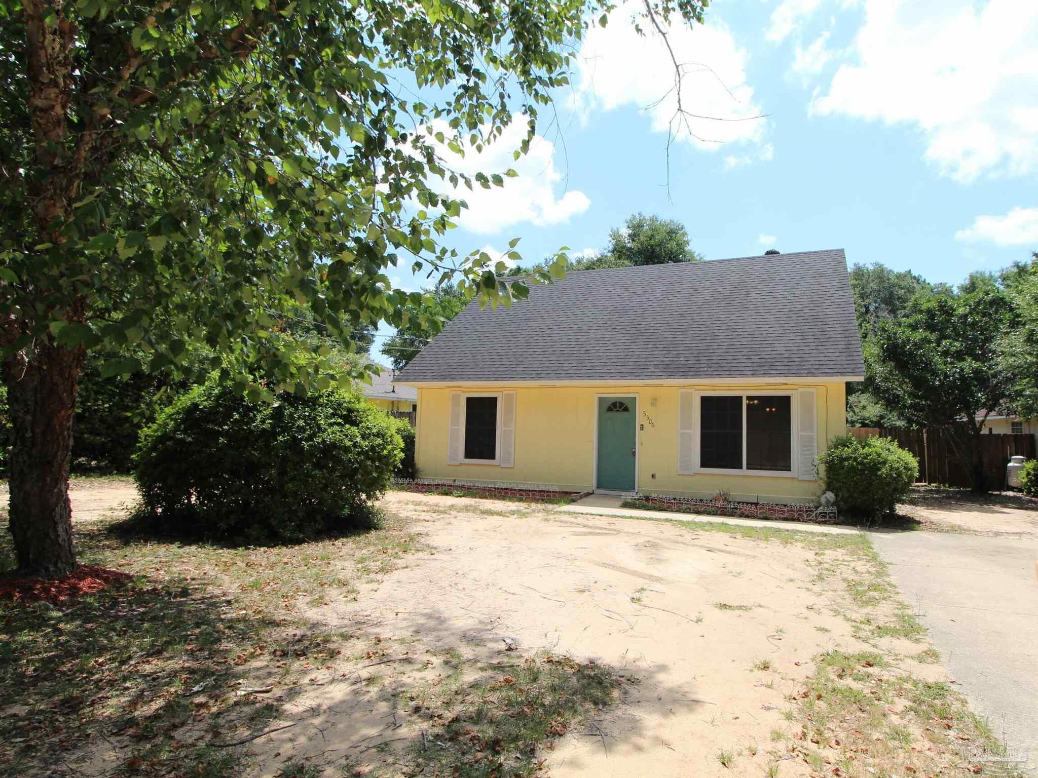 5306 Windham Road Milton, FL 32570 - Photo 1 of 15 a view of a house with a yard