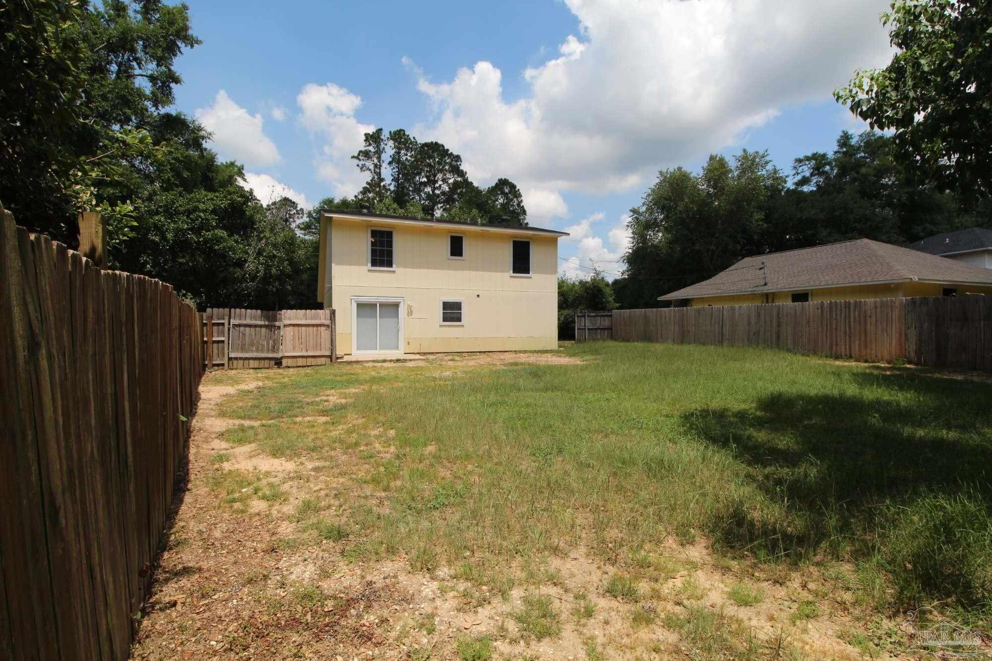 5306 Windham Road Milton, FL 32570 - Photo 13 of 15 a house view with a garden space