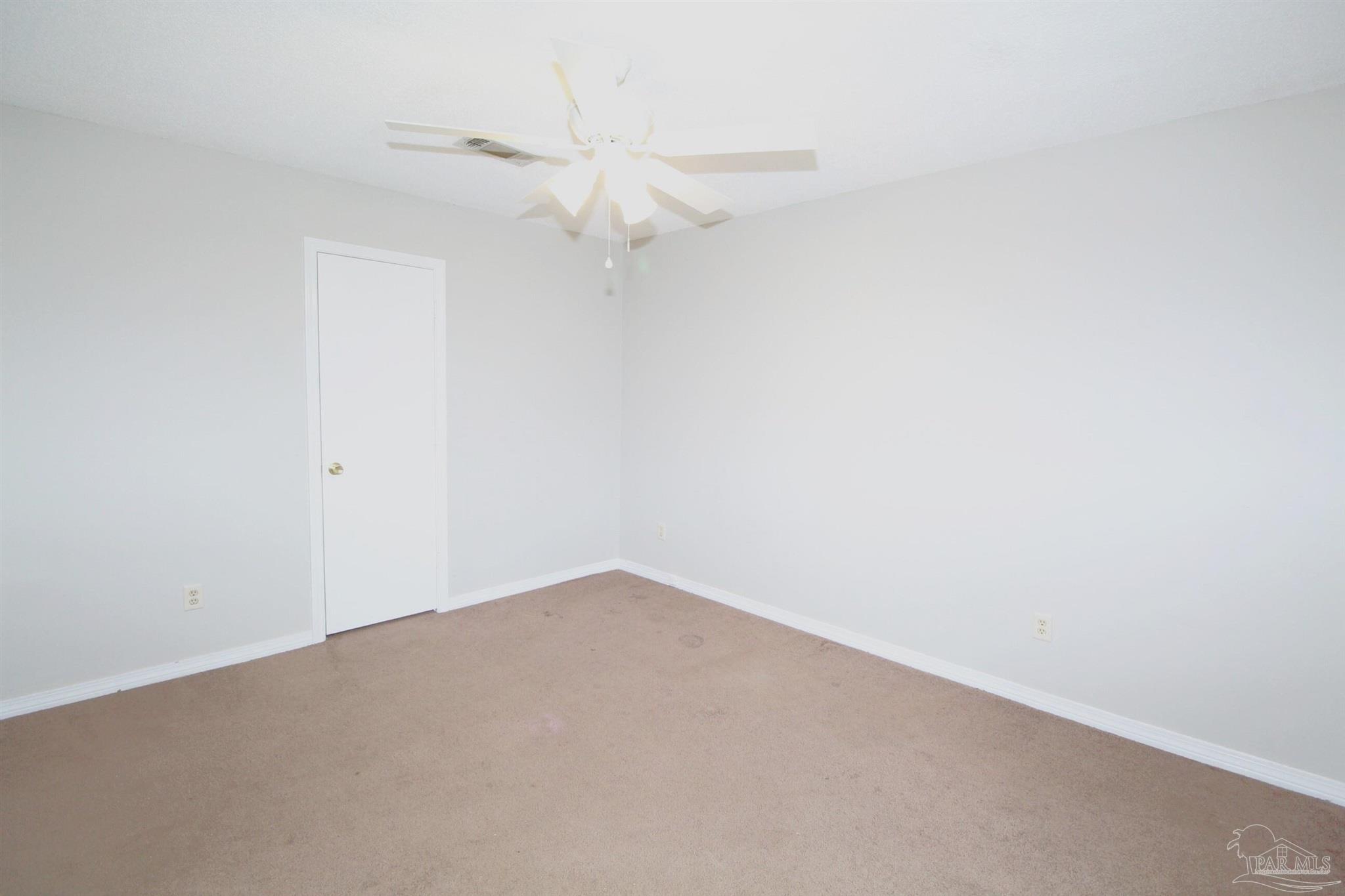 5306 Windham Road Milton, FL 32570 - Photo 8 of 15 an empty room with a fan & a window