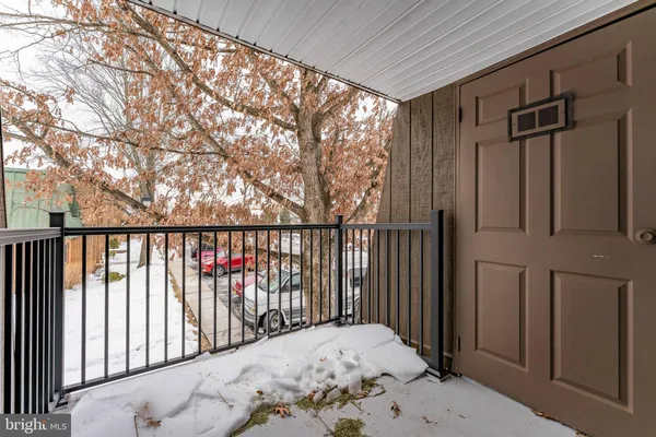 a view of balcony with wooden floor