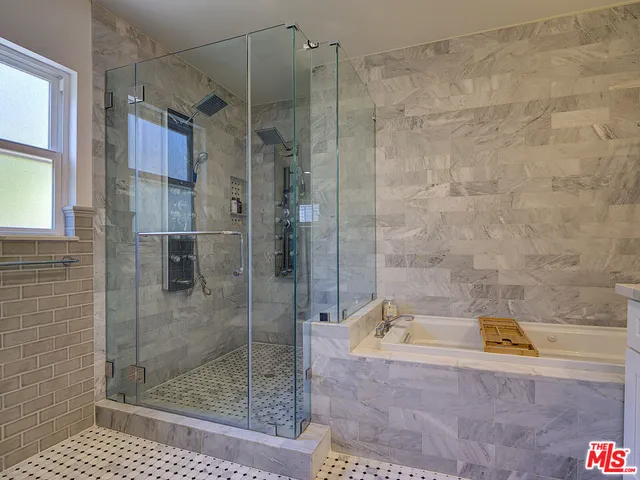 a bathroom with a shower and bathtub