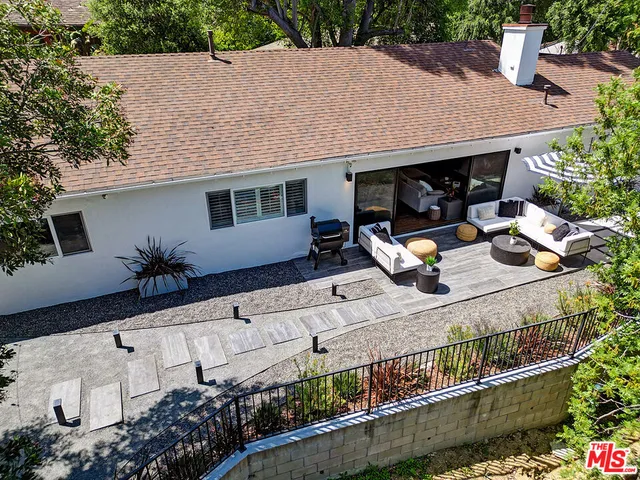 a view of house with outdoor space and sitting area
