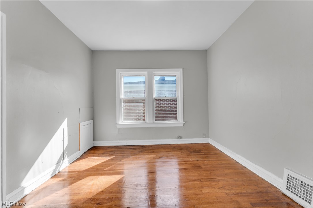 1499 Sherbrook Road South Euclid, OH 44121 - Photo 17 of 41 View of hardwood floored empty room