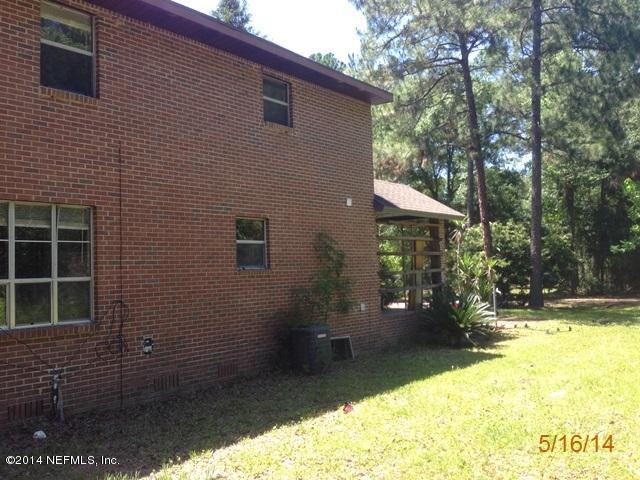 54694 Church Road Callahan, FL 32011 - Photo 17 of 22 a view of a house with backyard porch and sitting area
