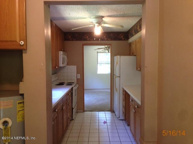 54694 Church Road Callahan, FL 32011 - Photo 2 of 22 a bathroom with a sink and a mirror