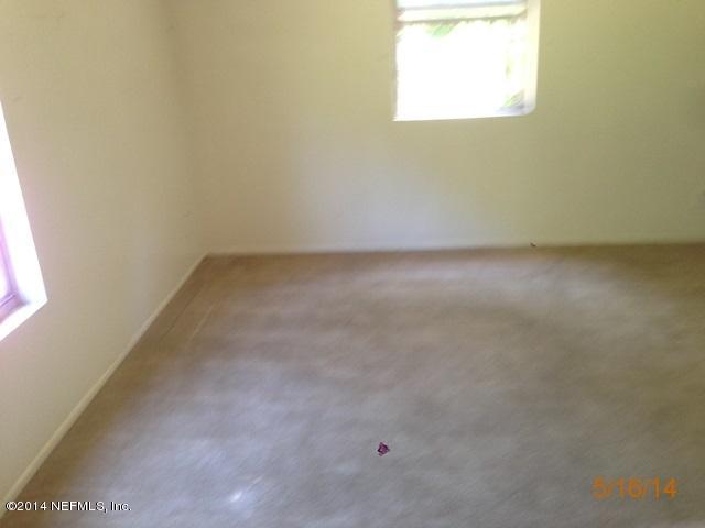 54694 Church Road Callahan, FL 32011 - Photo 3 of 22 an empty room with a window