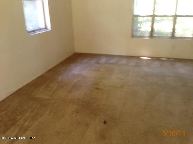 54694 Church Road Callahan, FL 32011 - Photo 4 of 22 an empty room with a window