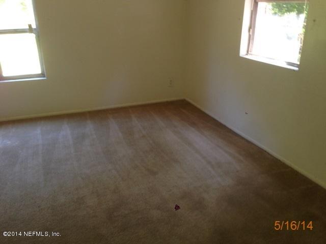 54694 Church Road Callahan, FL 32011 - Photo 7 of 22 an empty room with a window