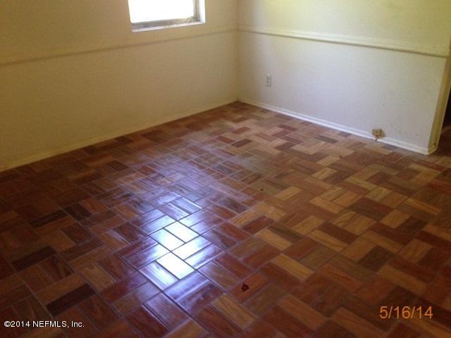 54694 Church Road Callahan, FL 32011 - Photo 9 of 22 a view of empty room with wooden floor and fan