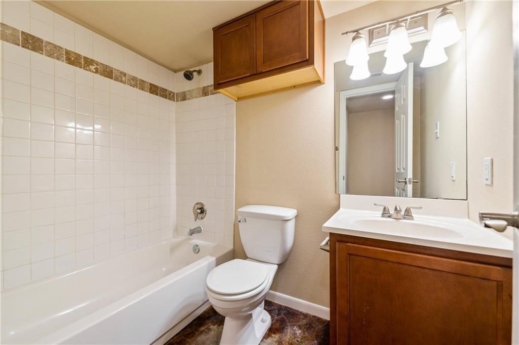 301 West 38th Street, Unit 109 Austin, TX 78705 - Photo 14 of 16 a bathroom with a sink toilet and shower